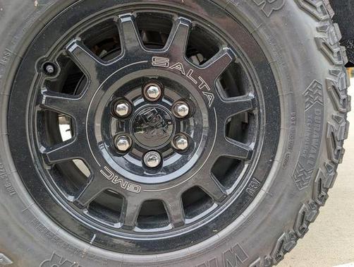 Volcanic Red Tintcoat 2026 GMC Sierra 1500 AT4X