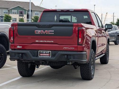Volcanic Red Tintcoat 2026 GMC Sierra 1500 AT4X