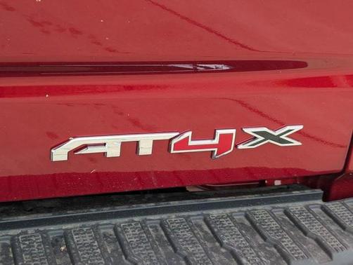 Volcanic Red Tintcoat 2026 GMC Sierra 1500 AT4X