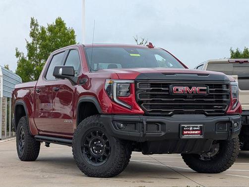 Volcanic Red Tintcoat 2026 GMC Sierra 1500 AT4X