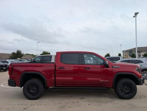 Volcanic Red Tintcoat 2026 GMC Sierra 1500 AT4X