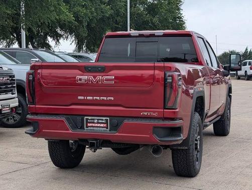 Volcanic Red Tintcoat 2026 GMC Sierra 2500 AT4