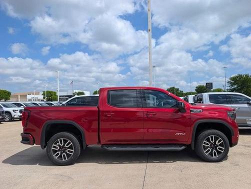 Volcanic Red Tintcoat 2026 GMC Sierra 1500 AT4