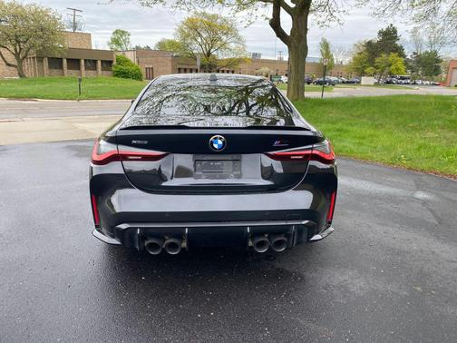 Black Sapphire Metallic 2024 BMW M4 Competition xDrive