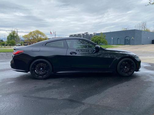 Black Sapphire Metallic 2024 BMW M4 Competition xDrive