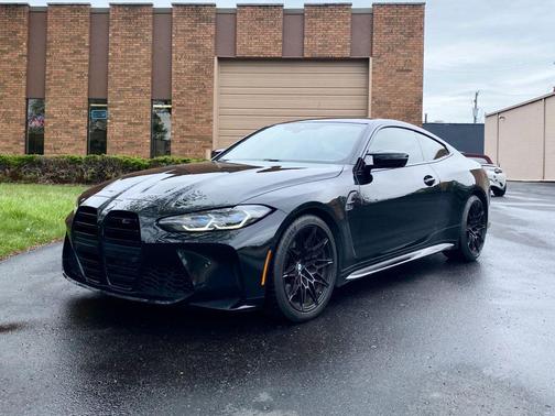 Black Sapphire Metallic 2024 BMW M4 Competition xDrive