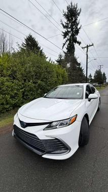 White 2023 Toyota Camry Hybrid LE