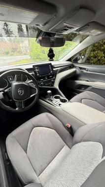 White 2023 Toyota Camry Hybrid LE