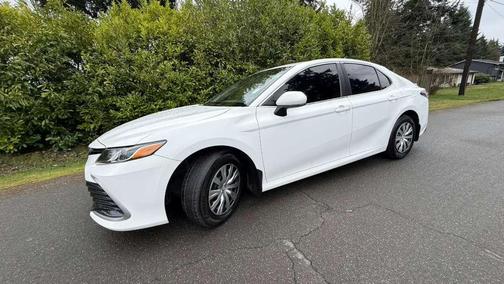 White 2023 Toyota Camry Hybrid LE
