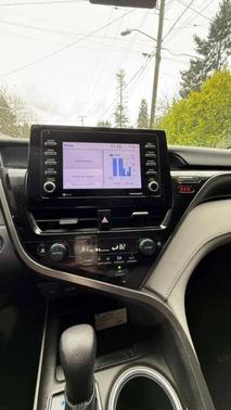 White 2023 Toyota Camry Hybrid LE