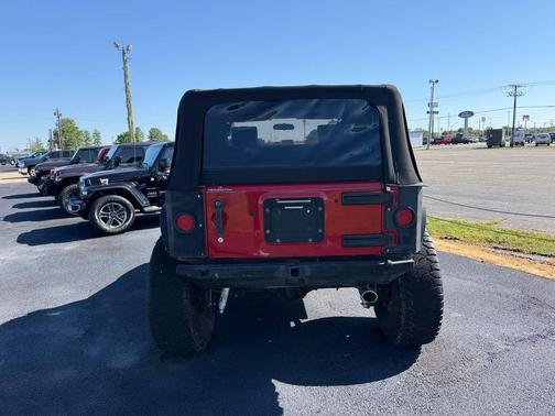 Red 2010 Jeep Wrangler Sport
