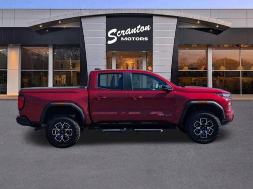 Volcanic Red Tintcoat 2024 GMC Canyon AT4X