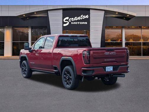 Volcanic Red Tintcoat 2026 GMC Sierra 2500 AT4