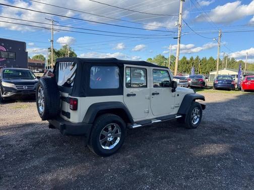Beige 2011 Jeep Wrangler Unlimited Sport