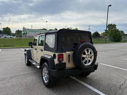 Beige 2011 Jeep Wrangler Unlimited Sport