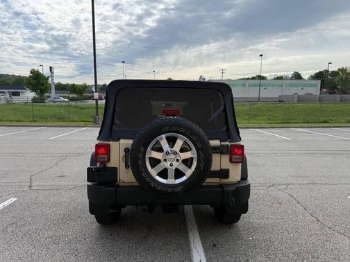 Beige 2011 Jeep Wrangler Unlimited Sport