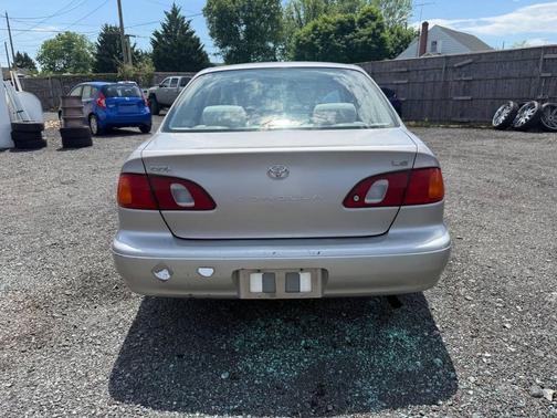 Tan 1999 Toyota Corolla CE