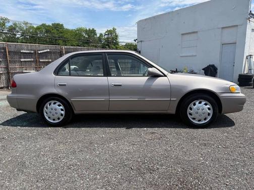 Tan 1999 Toyota Corolla CE