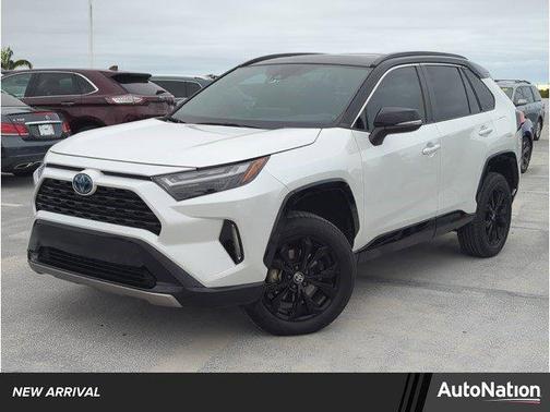 Wind Chill Pearl/Midnight Black Metallic 2023 Toyota RAV4 Hybrid SE