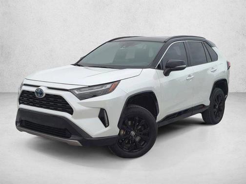 Wind Chill Pearl/Midnight Black Metallic 2023 Toyota RAV4 Hybrid SE