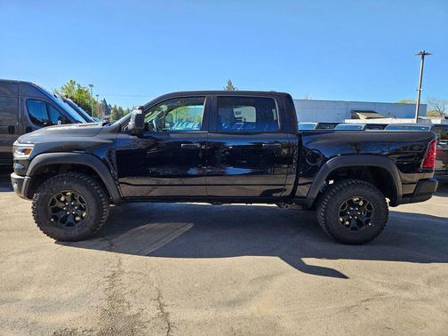 Diamond Black Crystal Pearlcoat 2026 RAM 1500 RHO Crew Cab 4x4 5'7' Box