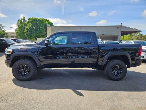 Diamond Black Crystal Pearlcoat 2026 RAM 1500 RHO Crew Cab 4x4 5'7' Box
