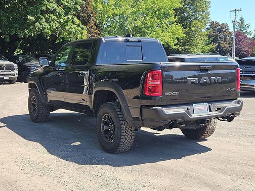 Diamond Black Crystal Pearlcoat 2026 RAM 1500 RHO Crew Cab 4x4 5'7' Box
