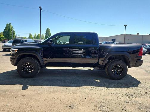 Diamond Black Crystal Pearlcoat 2026 RAM 1500 RHO Crew Cab 4x4 5'7' Box