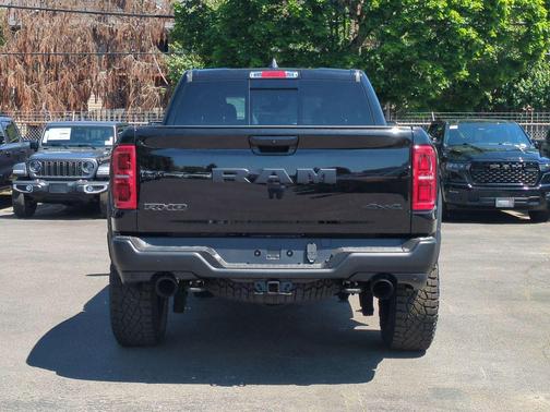 Diamond Black Crystal Pearlcoat 2026 RAM 1500 RHO Crew Cab 4x4 5'7' Box