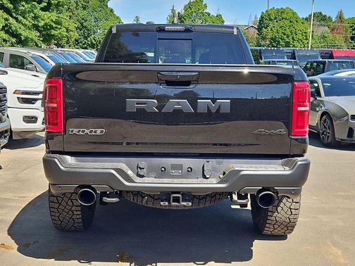 Diamond Black Crystal Pearlcoat 2026 RAM 1500 RHO Crew Cab 4x4 5'7' Box