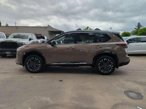 Baja Storm Metallic/Super Black 2025 Nissan Rogue Platinum