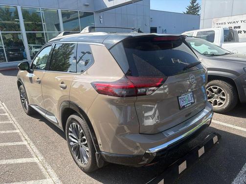 Baja Storm Metallic/Super Black 2025 Nissan Rogue Platinum