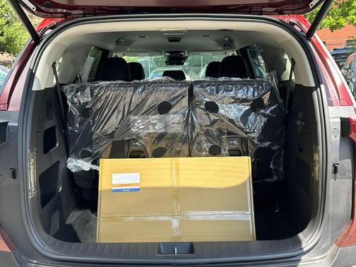 Red 2026 Kia Carnival Hybrid EX