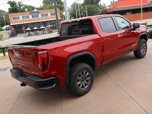 Volcanic Red Tintcoat 2026 GMC Sierra 1500 AT4X