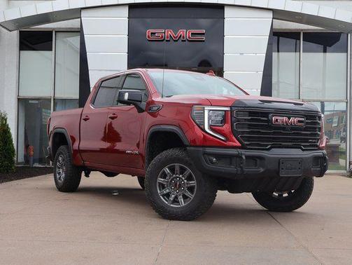Volcanic Red Tintcoat 2026 GMC Sierra 1500 AT4X