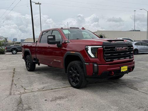 Volcanic Red Tintcoat 2024 GMC Sierra 2500 AT4