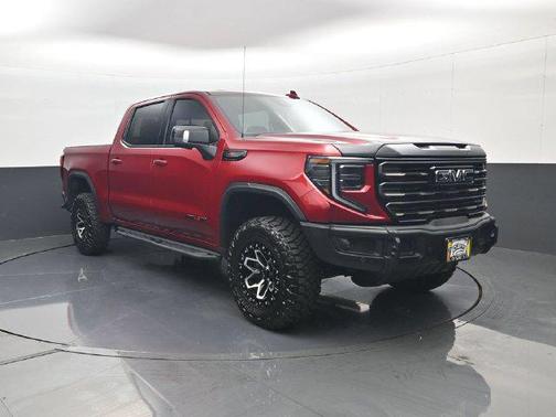 Volcanic Red Tintcoat 2026 GMC Sierra 1500 AT4X