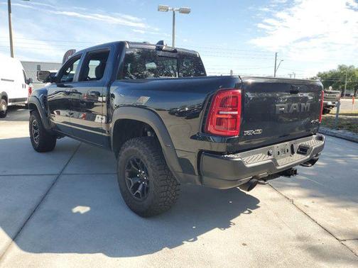 Diamond Black Crystal Pearlcoat 2025 RAM 1500 RHO Crew Cab 4x4 5'7' Box