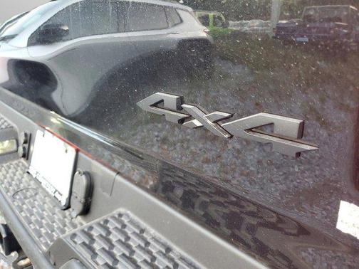 Diamond Black Crystal Pearlcoat 2026 RAM 1500 RHO Crew Cab 4x4 5'7' Box