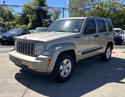 Tan 2011 Jeep Liberty Sport
