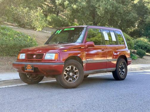 Red 1994 Suzuki Sidekick JX Sport Utility 4D