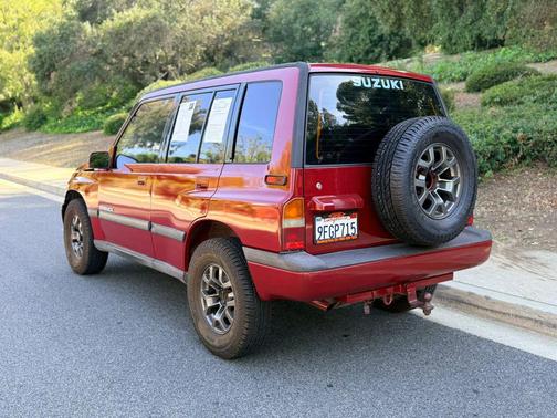 Red 1994 Suzuki Sidekick JX Sport Utility 4D