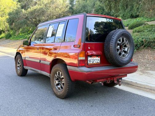 Red 1994 Suzuki Sidekick JX Sport Utility 4D