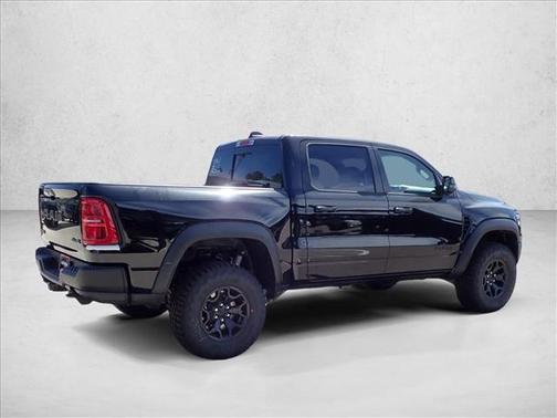 Diamond Black Crystal Pearlcoat 2026 RAM 1500 RHO Crew Cab 4x4 5'7' Box