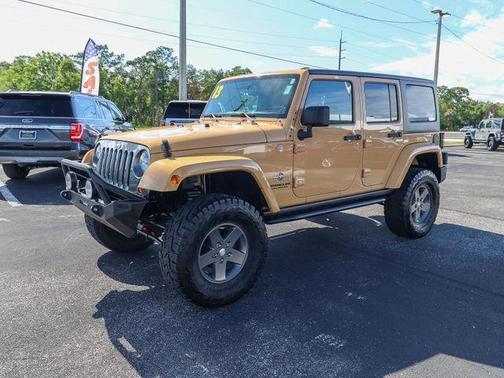 Tan 2013 Jeep Wrangler Unlimited Freedom Edition
