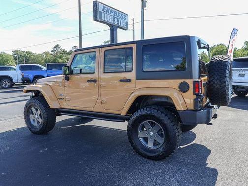 Tan 2013 Jeep Wrangler Unlimited Freedom Edition