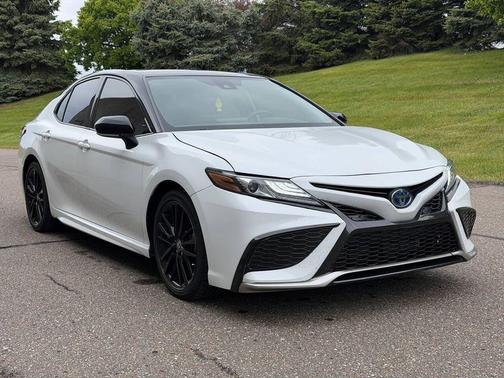 Midnight Black Metallic 2024 Toyota Camry Hybrid SE