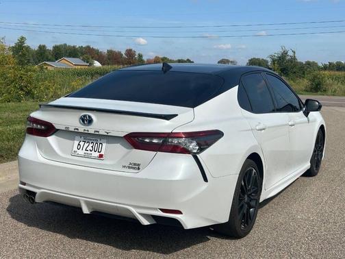 Midnight Black Metallic 2024 Toyota Camry Hybrid SE
