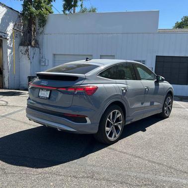 Pebble Gray 2024 Audi Q4 e-tron Sportback Premium Plus 55 quattro