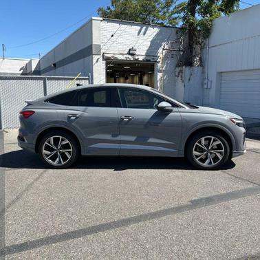 Pebble Gray 2024 Audi Q4 e-tron Sportback Premium Plus 55 quattro